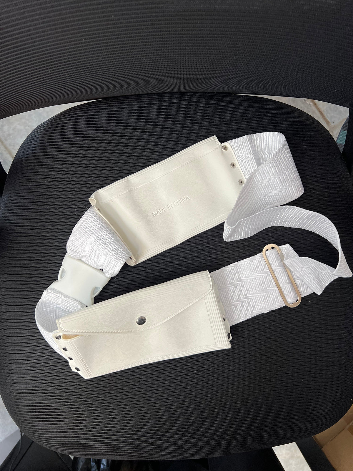 The ihram belt coiled on a dark surface, original photograph