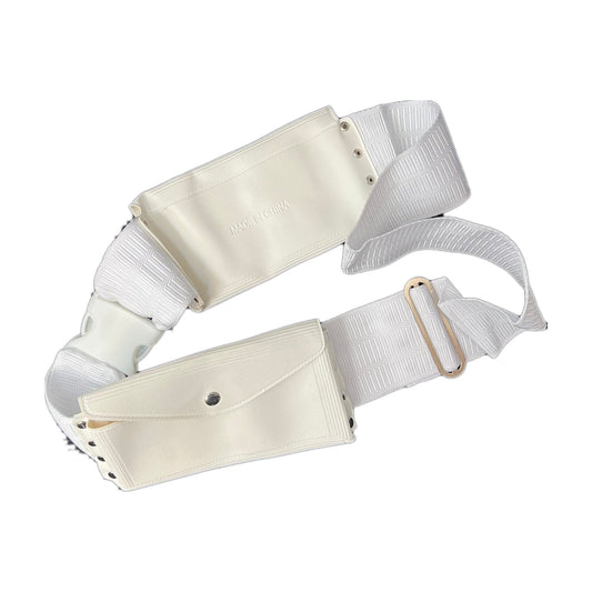 White ihram waist belt coiled, showing both snap pockets, the metal slide and the woven elastic band